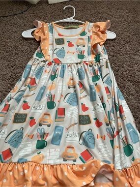 School-Print Cream Dress with Orange Ruffle Detail for Girls